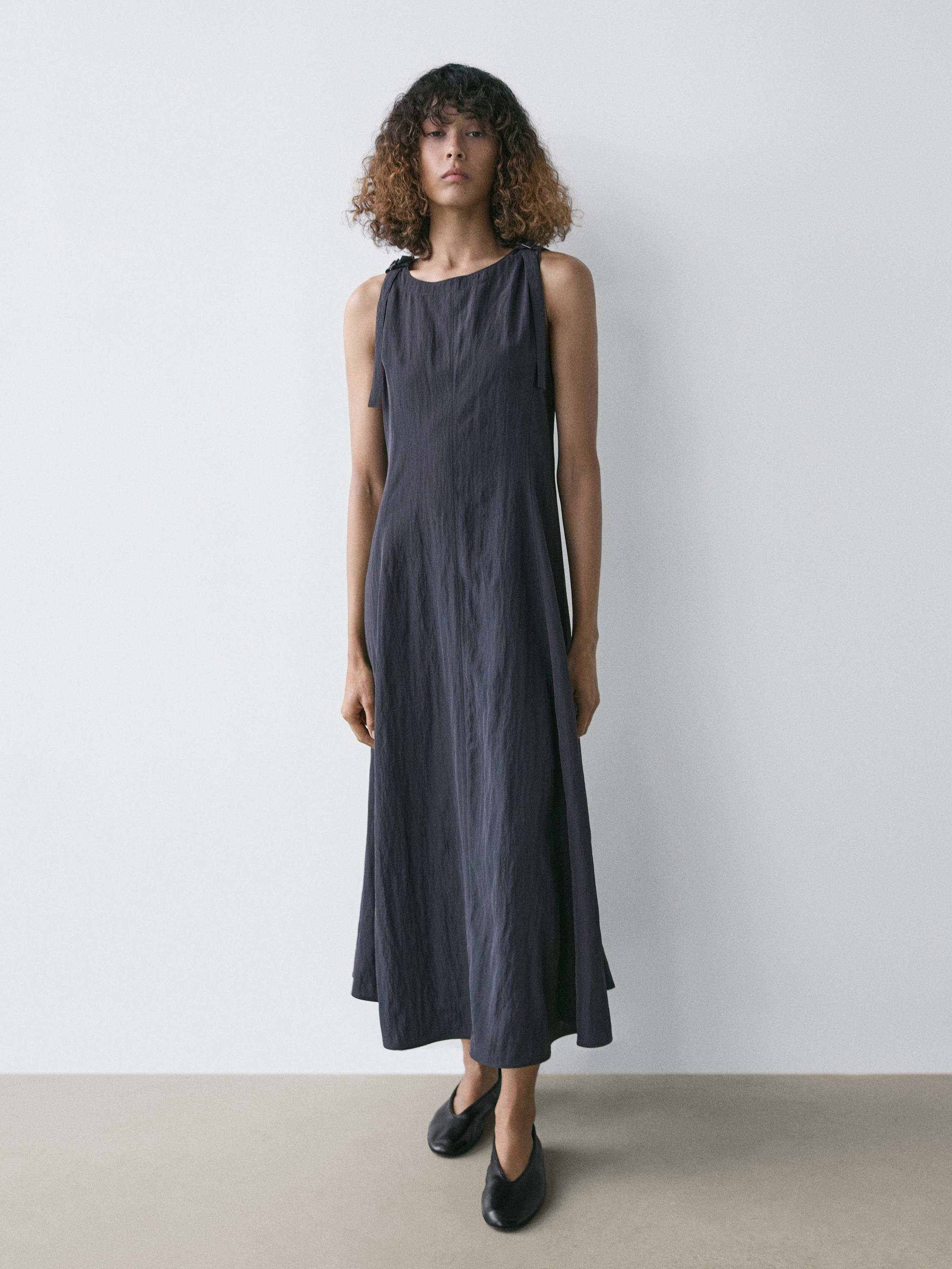 Flowing midi dress with buckles